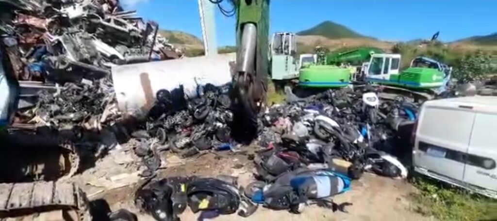 New Video KPSM Crushing Mopeds and Scooters in Compactor  Sint Maarten 